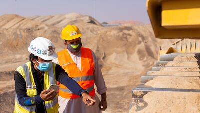 A Tenderd employee shows a machinery operator how an installed device monitors performance. Courtesy of Tenderd.