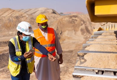 A Tenderd employee shows a machinery operator how an installed device monitors performance. Courtesy of Tenderd.