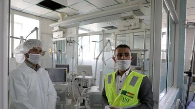 A nurse and a trainer during a lesson on how to operate ventilators recently provided by the World Health Organisation, in an intensive care ward for coronavirus patients in Sanaa. Reuters, file