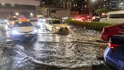 Cars drive through the rain in Dubai. Antonie Robertson / The National