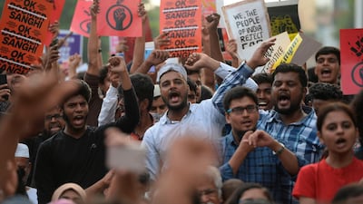 Students and demonstrators hold placards and shout slogans during a protest against India's new citizenship law in Chennai on December 19, 2019. Indians defied bans on assembly on December 19 in cities nationwide as anger swells against a citizenship law seen as discriminatory against Muslims, following days of protests, clashes and riots that have left six dead. AFP