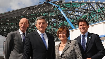 It's 2009 and British prime minister Gordon Brown visits the construction site with Olympics secretary Tessa Jowell, chairman of the London Organising Committee for the Olympic Games Lord Sebastian Coe, and chairman of the Olympic Delivery Authority John Armitt.