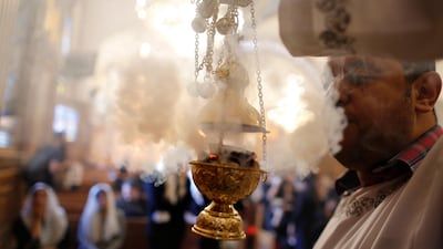 A priest spreads incense during funeral service for the slain Christians at Church of Great Martyr Prince Tadros. AP Photo