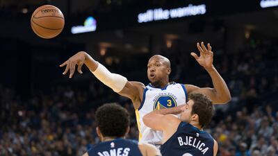 Golden State Warriors forward David West passes the basketball against Minnesota Timberwolves guard Tyus Jones and forward Nemanja Bjelica during the second quarter at Oracle Arena. Kyle Terada / USA TODAY Sports