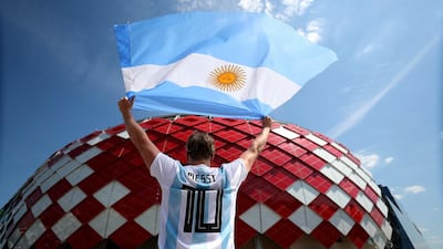 An Argentina fan poses outside the stadium prior to the game. Clive Rose / Getty Images