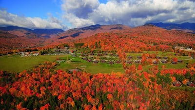 Aerial view of fall foliage including Trapp Family Lodge in Stowe, Vermont. The wiener schnitzel with lingonberry jam and apple strudel are must-haves when staying at the lodge. Don Landwehrle / iStockphoto.com