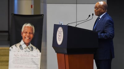 South African President Jacob Zuma makes a speech near a portrait of late South African president Nelson Mandela, on the anniversary of Mandela’s death, at Tsinghua University in Beijing. Greg Baker / AFP Photo