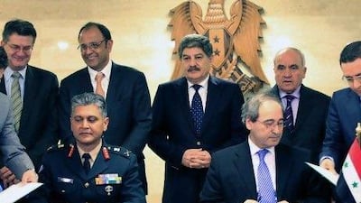 Syria and the United Nations signed an agreement yesterday on terms for hundreds of observers to monitor the ceasefire, but Syria only wants UN monitors from Russia, China, India, Brazil and South Africa. Louai Beshara / AFP Photo