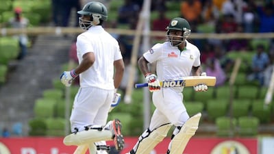 Tamim Iqbal, left, and Imrul Kayes run between the wickets during the fifth day of the first Test between Bangladesh and Pakistan. AFP