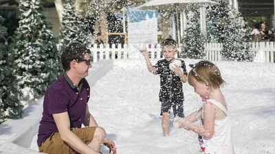 Families enjoy their time in the snow ball zone in Abu Dhabi. Mona Al Marzooqi / The National