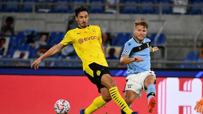 Lazio's Ciro Immobile gets in a cross under pressure from Mats Hummels of Dortmund. Getty