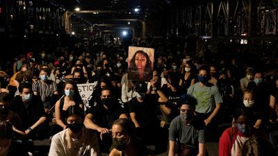People hold a moment of silence during the march for Breonna Taylor in New York City, New York, on September 25, 2020. Reuters