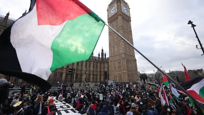 Protesters stage a sit-in on Westminster Bridge in London during a march in support of Palestine. EPA