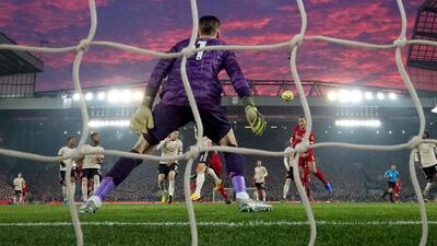 Liverpool's Virgil van Dijk, right, scores his side's first goal. AP Photo
