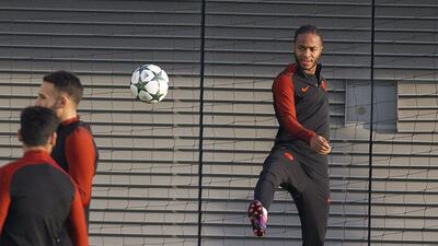 Manchester City’s Raheem Sterling kicks the ball during training. Peter Powell / EPA