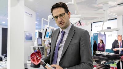 Dr Robert Smith, a consultant cardiologist explains how an aortic valve can be fixed without needing open-heart surgery. Antonie Robertson / The National