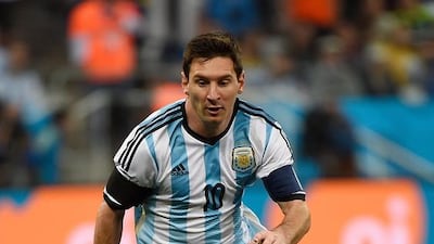 Argentina's forward and captain Lionel Messi runs with the ball during the semi-final football match between Netherlands and Argentina of the Fifa World Cup at The Corinthians Arena in Sao Paulo on July 9, 2014. AFP PHOTO / PEDRO UGARTE