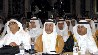 Chairman of the Dallah Albaraka Group Saleh Kamel, left, with the then Saudi minister of trade and economy Dr Hashem Yamani, right, and Saudi businessman Osama Jaafar Faqih, centre, at the Jeddah Economic Forum on January 17, 2004. AFP