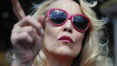 Jerry Hall looks around a stand. Getty Images