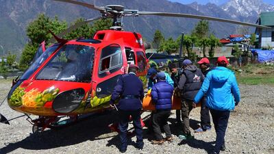 Official carry the body of Nepalese mountaineer Min Bahadur Sherchan brought to Lukla heli pad on May 7, 2017. The 85-year-old ex-Gurkha who was attempting to reclaim his title as the world's oldest person to summit Mount Everest died at base camp on May 6. AFP