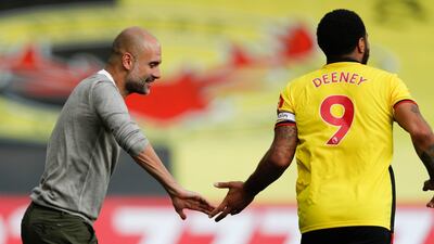 roy Deeney of Watford and City manager Pep Guardiola. EPA