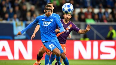 Hoffenheim's Kevin Akpoguma, left, and Aguero vie for the ball. AFP