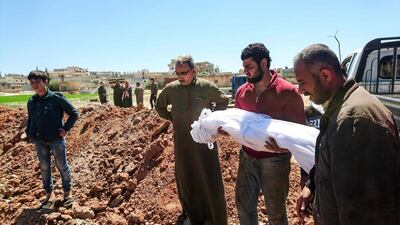 Syrians bury the victims of a toxic gas attack in Khan Sheikhoun, a rebel-held town in Syria’s northwestern Idlib province, on April 5, 2017. Fadi Al Halabi / AFP