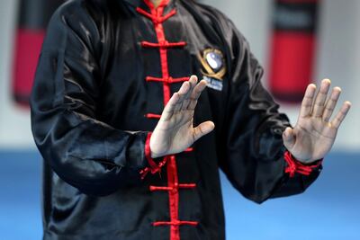 The up and down hand movement in tai chi is used as a block in case of attacks. Chris Whiteoak / The National