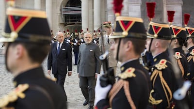 French foreign minister Laurent Fabius, centre left, and Indian prime minister Narendra Modi, centre right, review an honour guard during a welcoming ceremony in the courtyard of the Hotel des Invalides in Paris, France on April 10, 2015. Ian Langsdon/pool/AP Photo