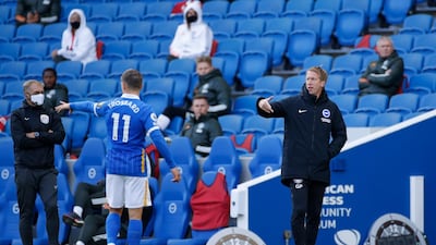 Brighton manager Graham Potter speaks with Leandro Trossard. Reuters