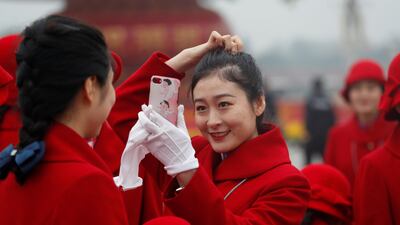 "Hailing the start of a "new era," Mr Xi outlined a vision in which the party would lead China on the road to becoming a "great modern socialist country" by 2050. Ahmad Masood / Reuters