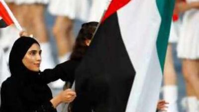 Sheikha Maitha carries the UAE's flag at the opening ceremony.