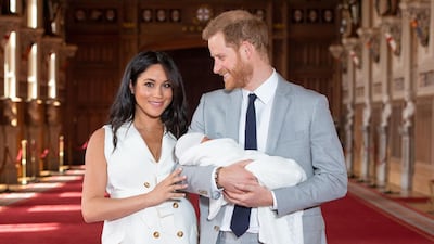 Britain's Prince Harry, Duke of Sussex, and his wife Meghan, Duchess of Sussex, pose for a photo with their newborn baby son Archie. AFP