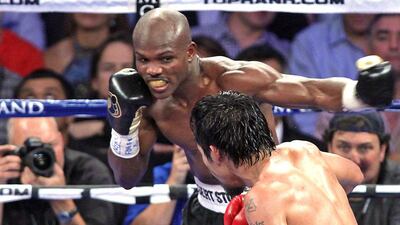 Timothy Bradley throws a punch at Manny Pacquiao during victory over the Filipino in their high-profile June 2012 bout. John Gurzinski / AFP