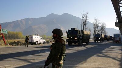 The Indian army and paramilitary soldiers stand guard on the outskirts of Srinagar, the summer capital of Kashmir. EPA