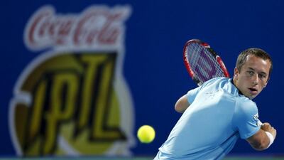 Japan Warriors’ Philipp Kohlschreiber of Germany hits a return to Micromax Indian Aces’ Bernard Tomic of Australia during their match at the International Premier Tennis League (IPTL) in Dubai, December 14, 2015. REUTERS/Ahmed Jadallah