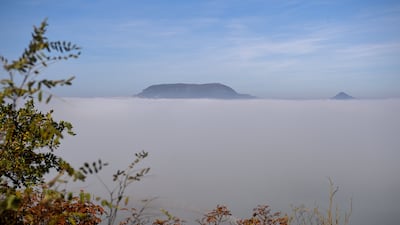 Mount Badacsony rises from a sea of fog over Lake Balaton, Hungary. EPA