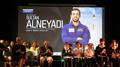 Dr Al Neyadi holds a call with schoolchildren at Jumeirah College in Dubai. Pawan Singh / The National