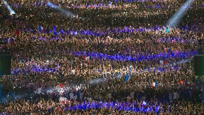 An aerial picture shows France’s supporters celebrating after France won the Euro 2016 semi-final football match against Germany, at the Champ de Mars fan zone in Paris. Geoffroy Van der Hasselt / AFP