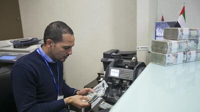 UAE banks, left, will benefit from Expo 2020 and the Saudi government says it will pay construction bills within 60 days. Fayez Nureldine / AFP; Mona Al Marzooqi / The National