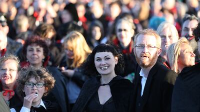 They needed to stand together in the same place for five minutes to break the Guinness record, which previously stood at 1,039 people, set at a 2011 event in the US state of Virginia. PA