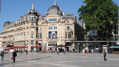 Montpellier’s grand square the Place de la Comédie houses an ornate 18th-century opera house and a row of cafes. Photo by Adam Baterbee