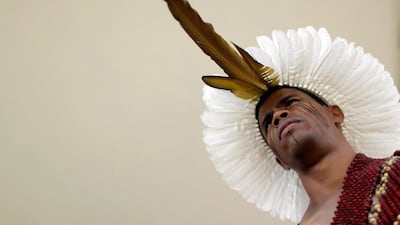 An indigenous man from the Pataxo tribe occupies the entrance of the Planalto Palace during a protest of indigenous people from various tribes against agribusinesses and in demand of the demarcation of their ancestral lands, in Brasilia, Brazil. Ueslei Marcelino / Reuters