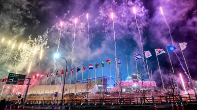 Fireworks explode outside the stadium during the opening ceremony. Jung Yeon-Je / AFP