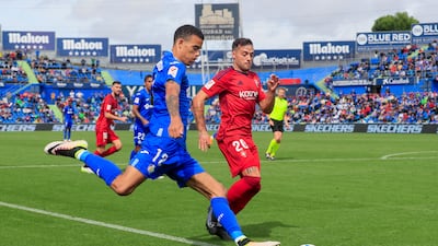 Getafe striker Mason Greenwood in action against Osasuna midfielder Jose Arnaiz. EPA