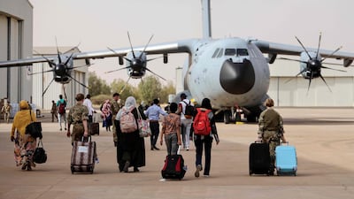 Britions board a Royal Air Force plane in Sudan, for evacuation to Cyprus. AFP