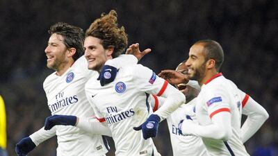 Paris Saint-Germain’s Adrien Rabiot, centre, celebrates with teammates after scoring the opening goal. Gerry Penny / EPA