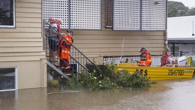 Volunteers are seen rescuing residents in Rosslea. EPA