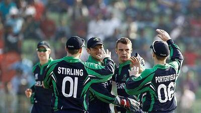 Ireland's players celebrate after a job well done in the field against the UAE. AM Ahad / AP Photo