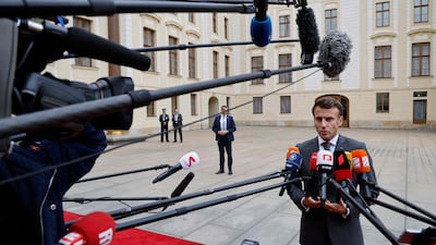 French President Emmanuel Macron speaks to media as he arrives at Prague Castle. AFP